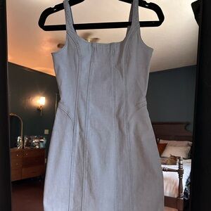 Denim light wash sleeveless dress by Miou Muse. Bodycon style.